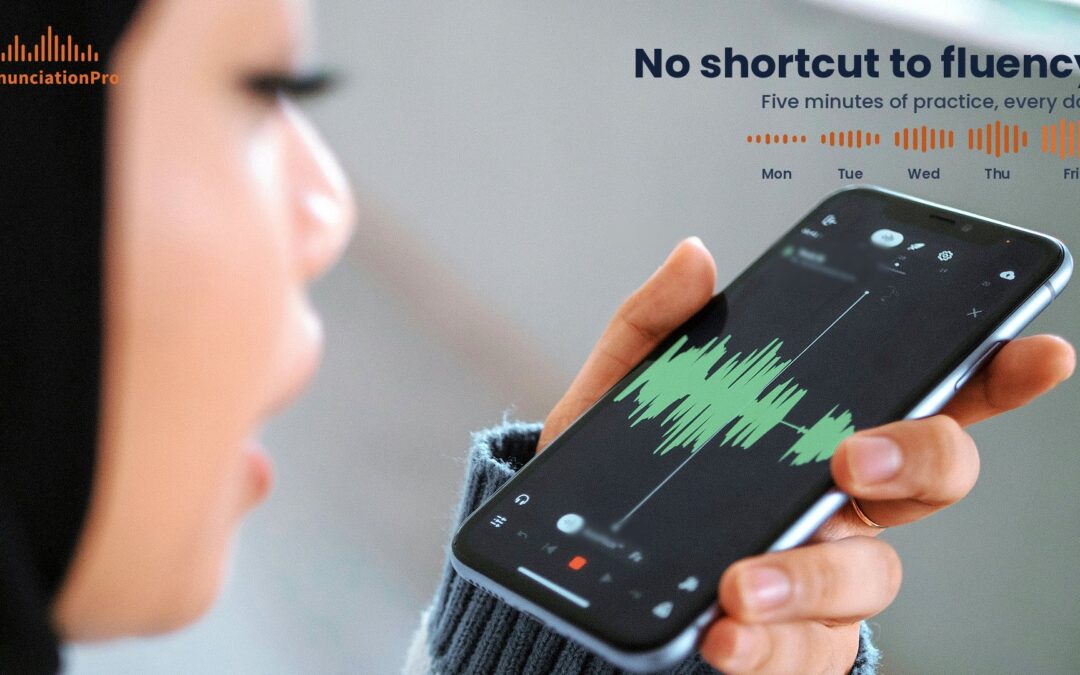 Woman in a dark headscarf speaking into her smartphone as it records her voice, a green sound wave on the screen, during short daily English pronunciation practice