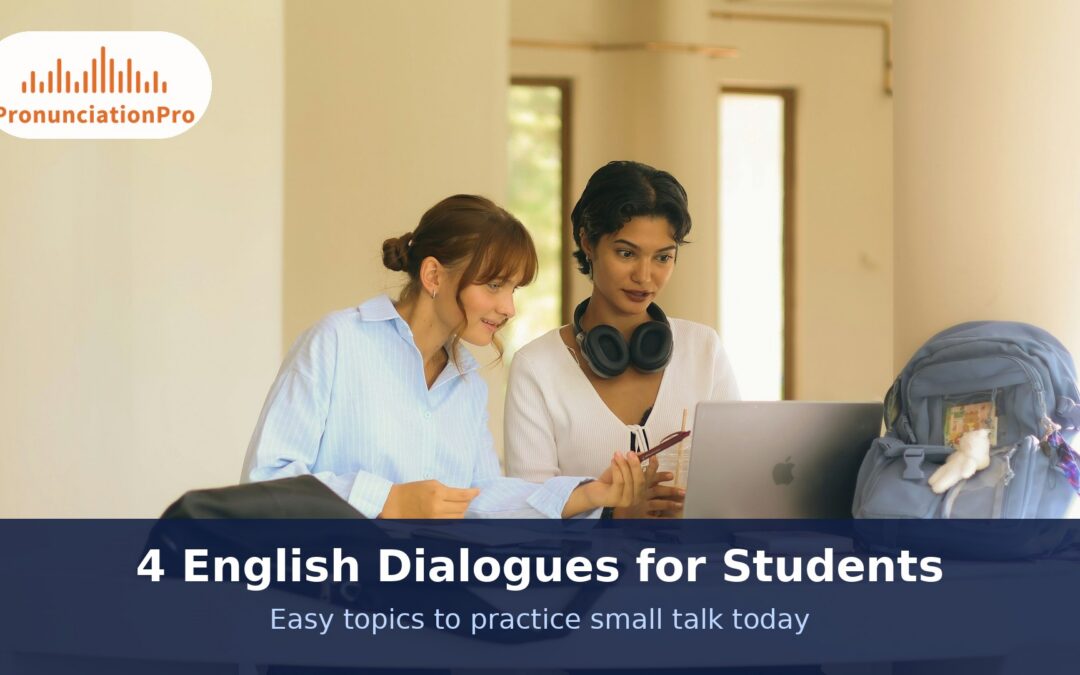 Two students talking together at a table with a laptop