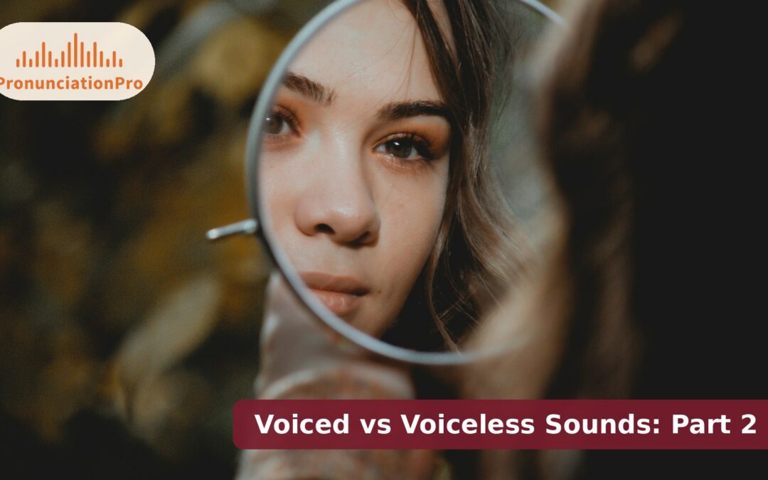Learner using a mirror to practice voiced vs voiceless consonant pairs